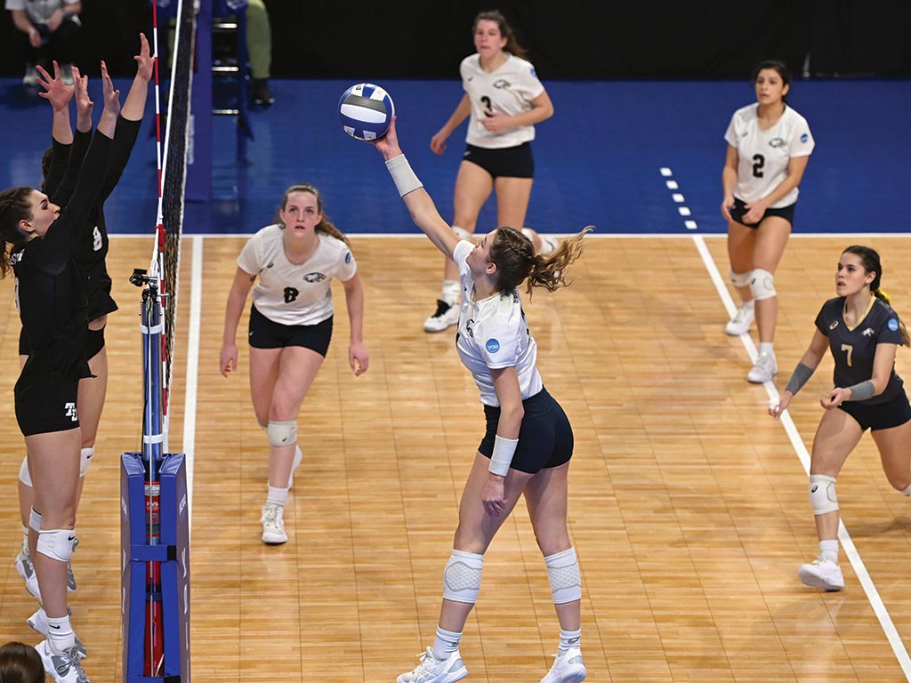 Photo by JD Cavrich Outside hitter and defensive specialist Kennedy Christy ’24 goes for a kill during the team’s NCAA Division III Women’s Volleyball Championship game against Trinity University.