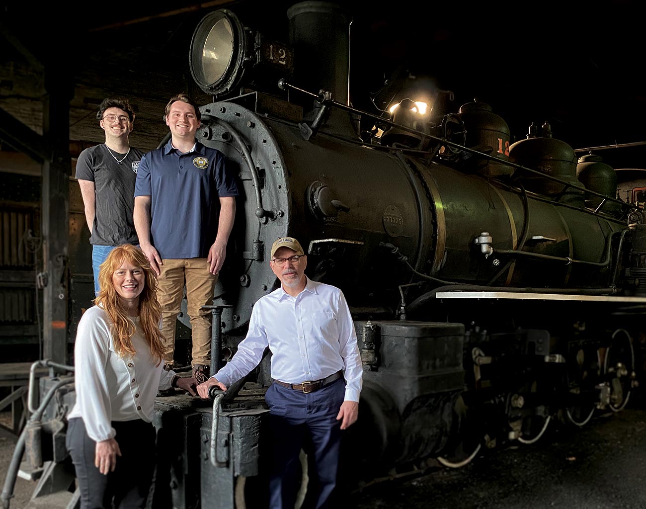 photo of faculty and students with an engine at the East Broad Top Railroad