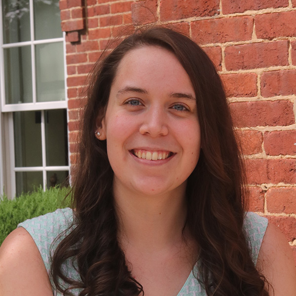 Evelyn McCammon poses for a picture outside of Founder's Hall at Juniata College.