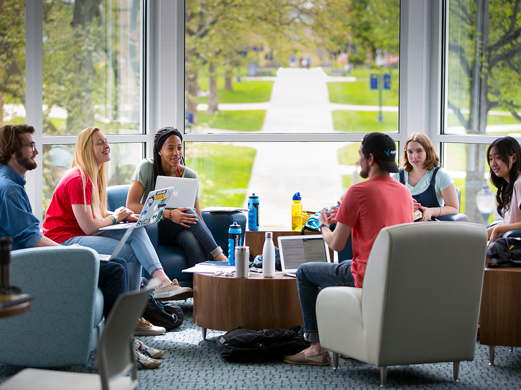 group of students discussing in Ellis Hall