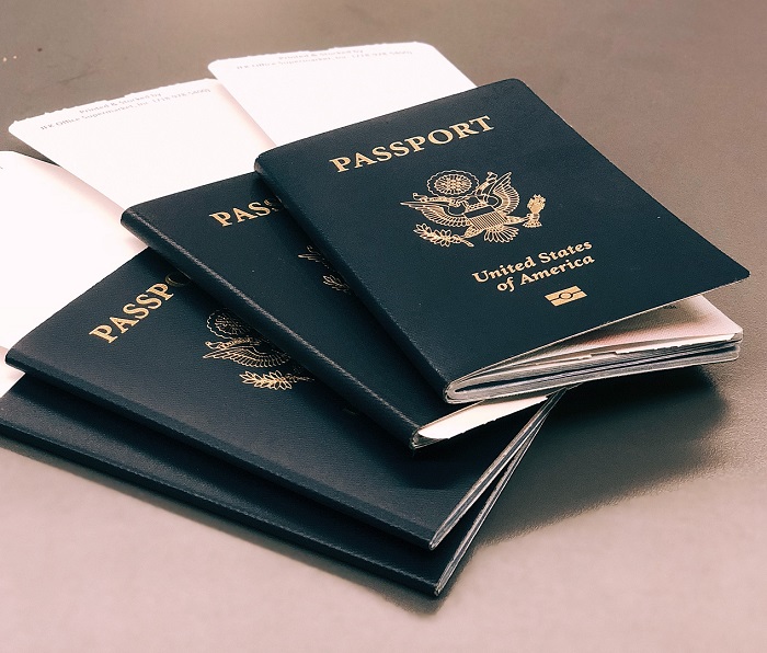 stack of three United States passports