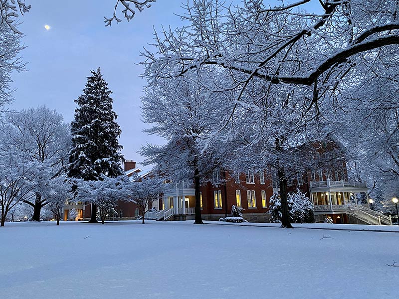phot of Founders Hall on a snowy evening