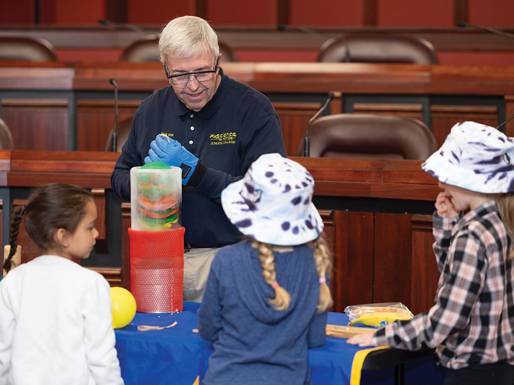 Rick Imler, Science in Motion chemistry instructor, leads an experiment for local students