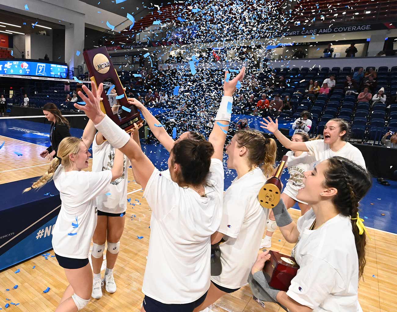 photo of womens volleyball team celebrating