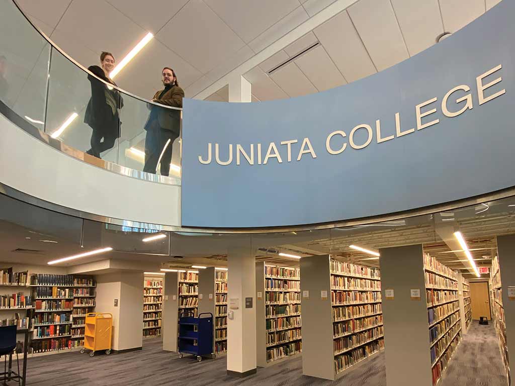 Shane Moran, archive and special collections librarian, speaks with a student at the Statton Learning Commons.