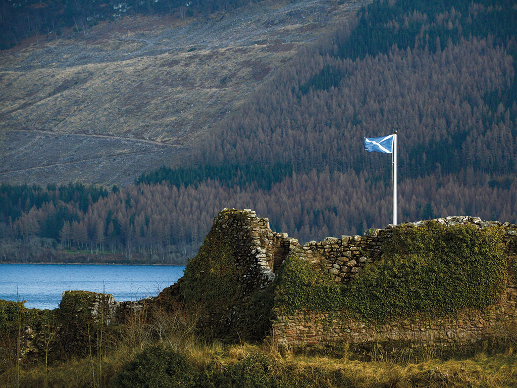 photo of Scottish flag on a stone wall