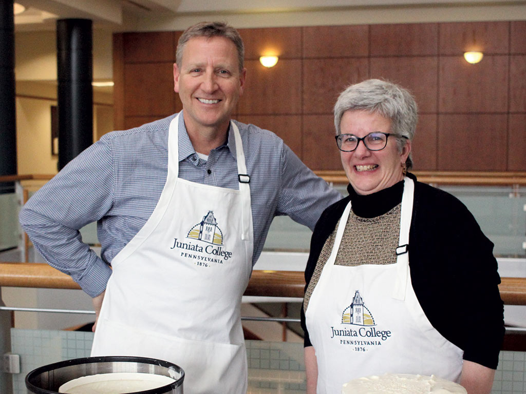 Jim Troha and Lauren Bowen serve ice cream