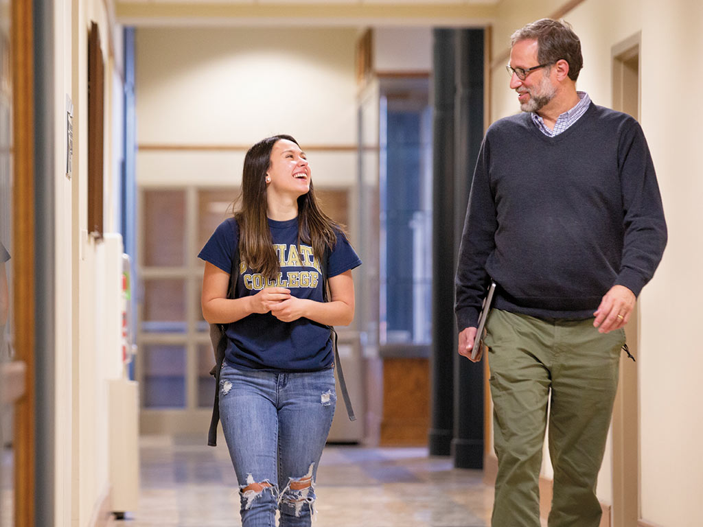 photo of Jay Hosler walking with student