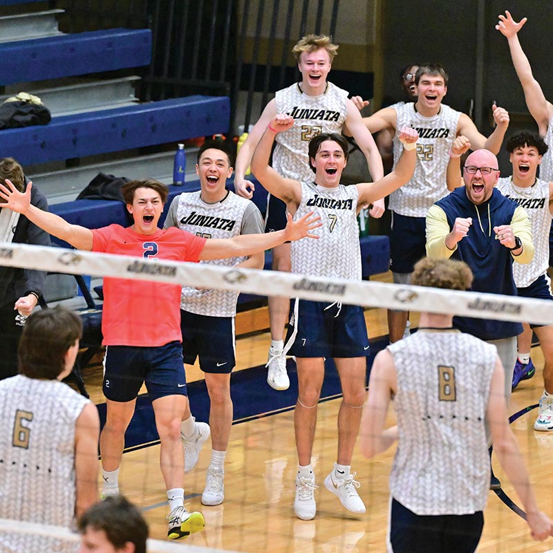 photo of men's volleyball team celebrating