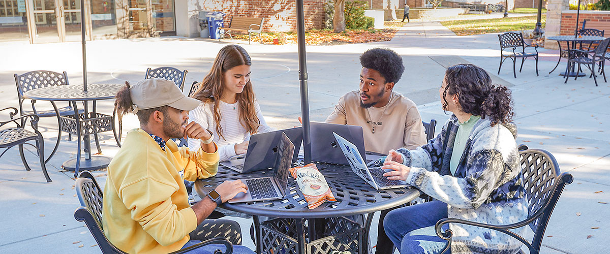 Students gather to work outdoors